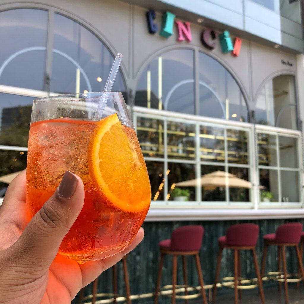 Classic Aperol with restaurant facade in background